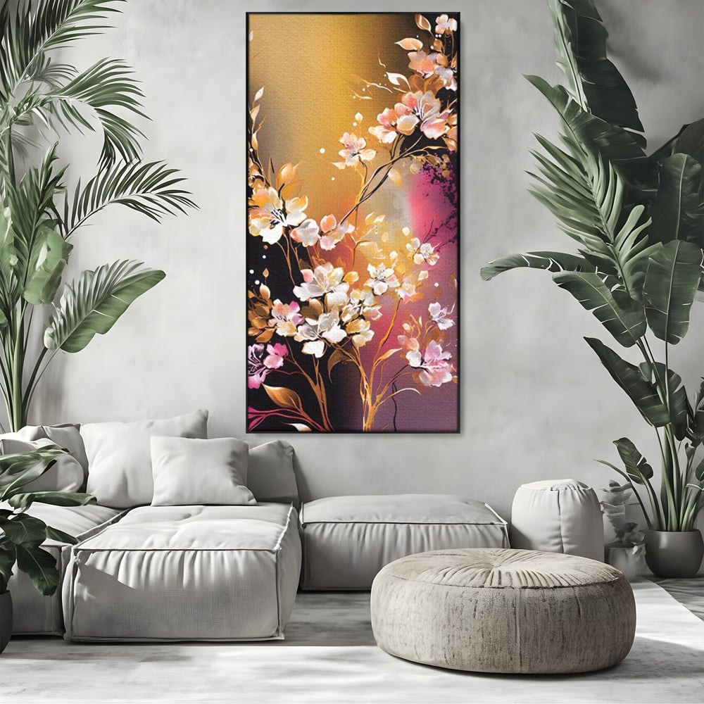 Tablou canvas cu pictura verticala cu ramura inflorita, in rama de aluminiu negru, pe perete intr-un living
